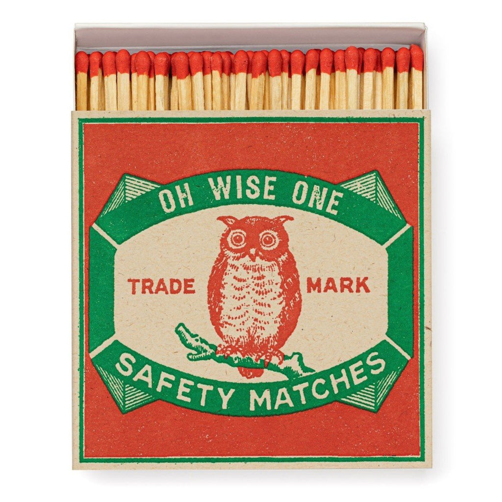 A decorative matchbox with an owl