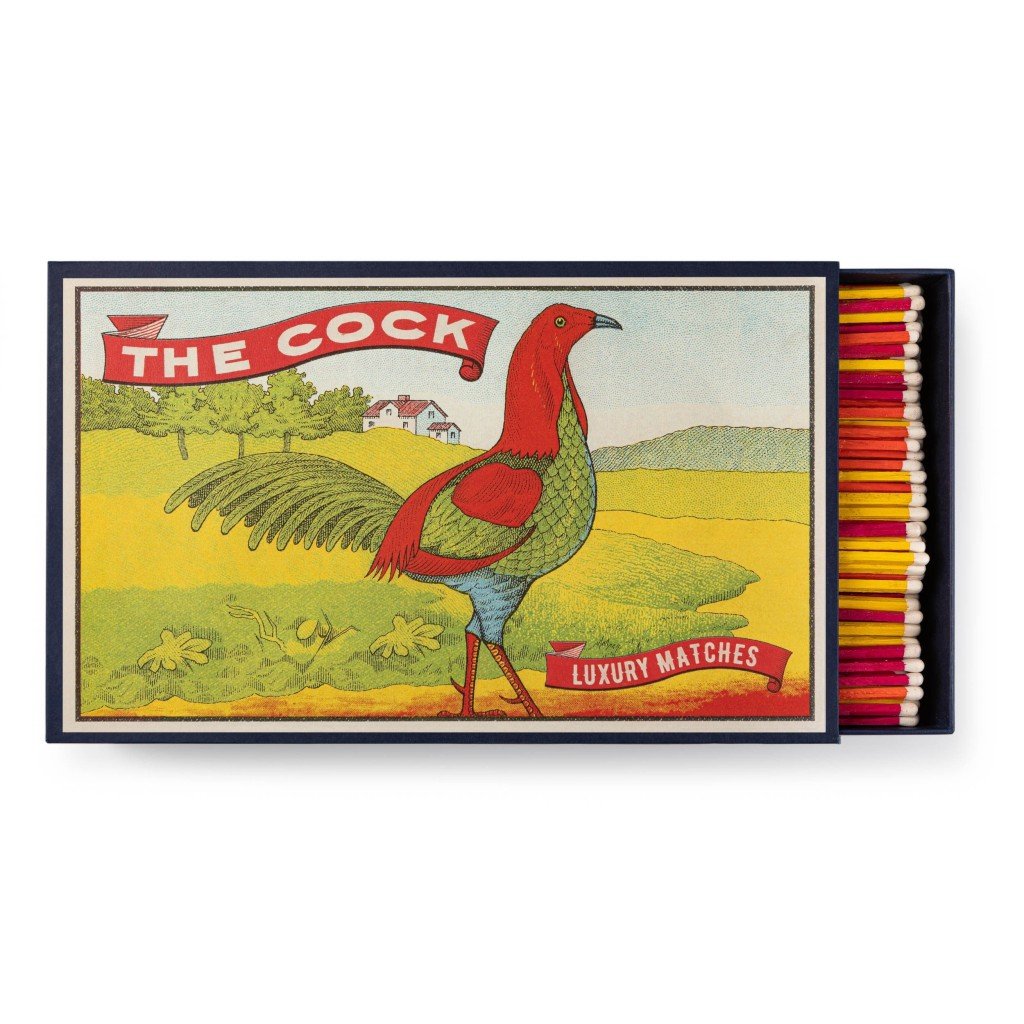A decorative matchbox with a roaster