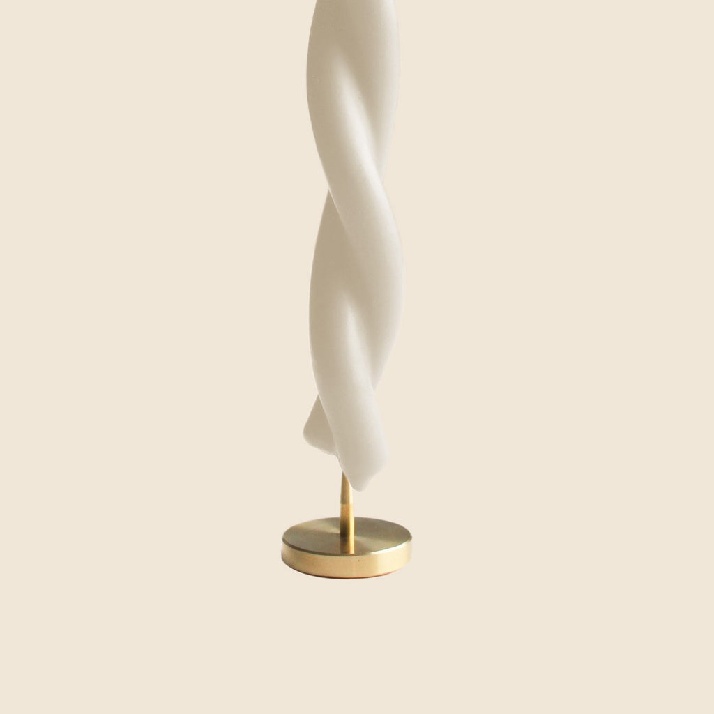 Spike candle holder with white candle