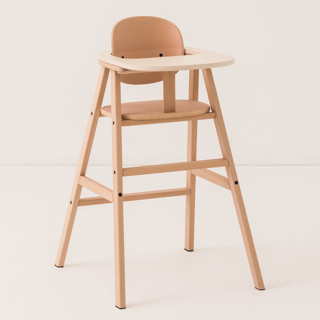 A wooden high chair on white background