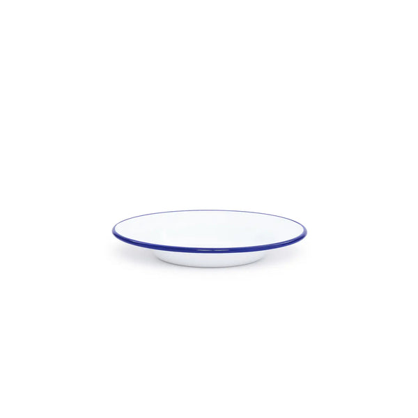 White bowl with blue rim on a white background