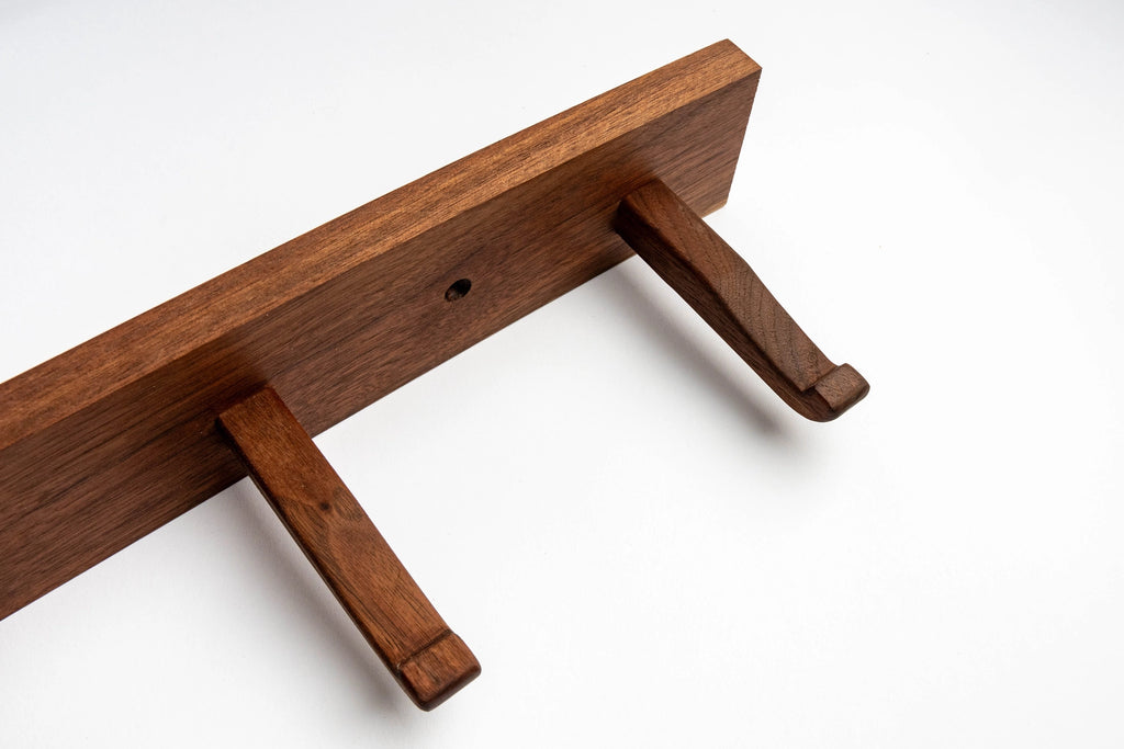 Wooden shelf bracket on a white background