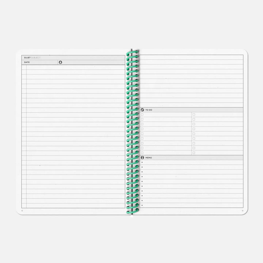 Two spiral-bound planners with grid and plain pages on a white background