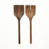 Two wooden salad spoons on a white background