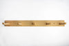 Wooden coat rack with five hooks on a white background