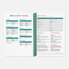 Open spiral-bound reference book with tables and text on a white background
