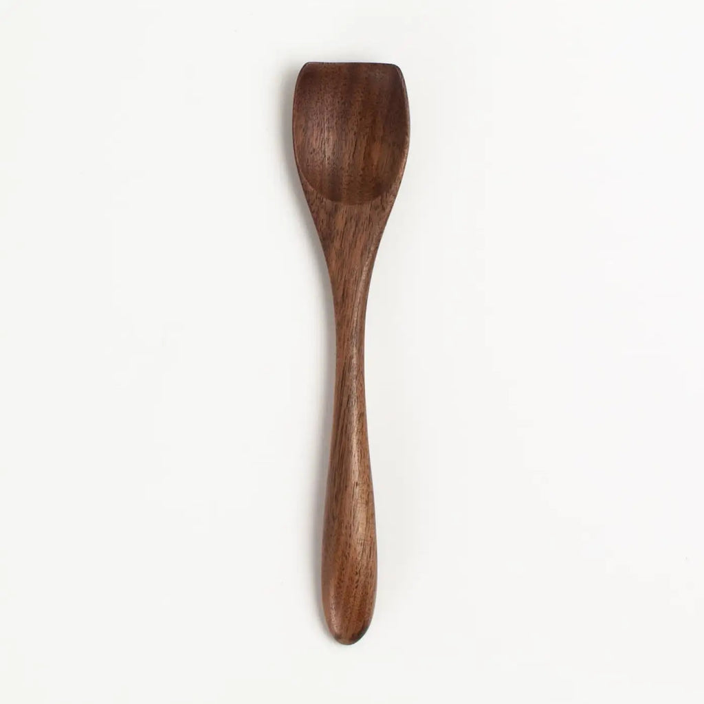Wooden spoon on a white background