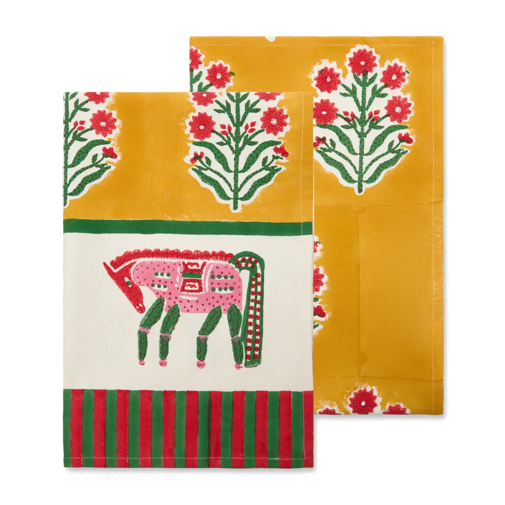 Two colorful tea towels with floral and animal designs on a white background