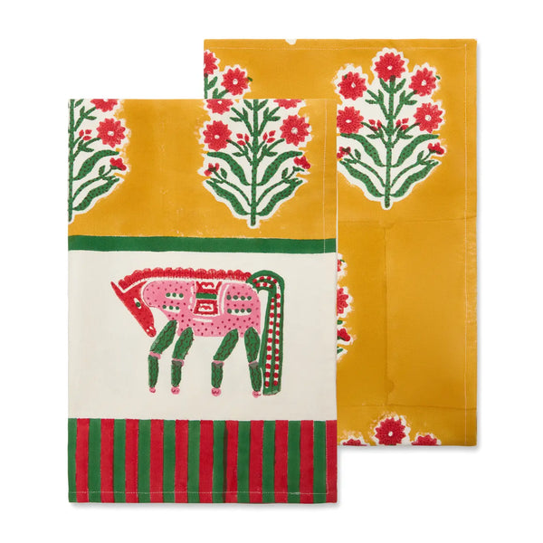 Two colorful tea towels with floral and animal designs on a white background