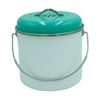 Turquoise metal canister with a white interior on a white background