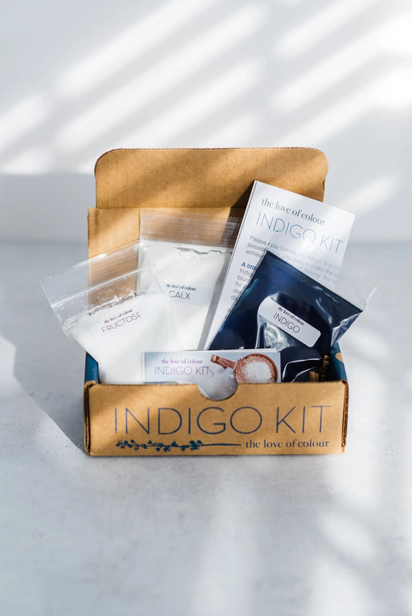 Indigo Kit packaging with various items on a light background