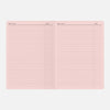 Pink notebook page with ruled lines on a white background