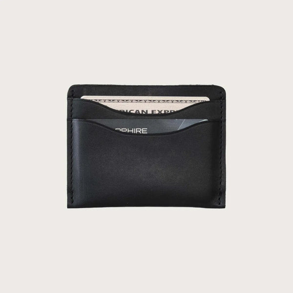 Black leather wallet on a light gray background