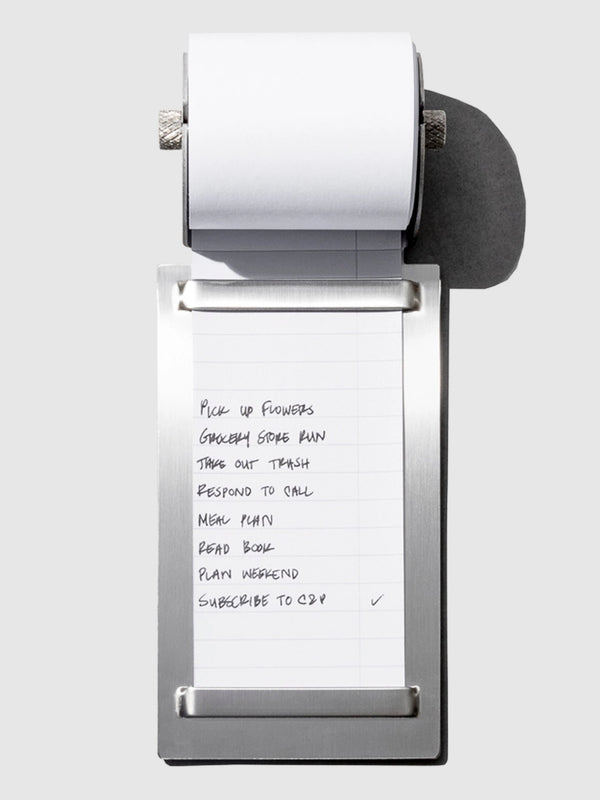 A task roller with a lined notepad sheet hanging from a metallic silver frame, shown on a light gray background.