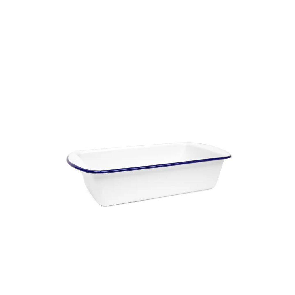 White enamel loaf pan with blue rim on a white background