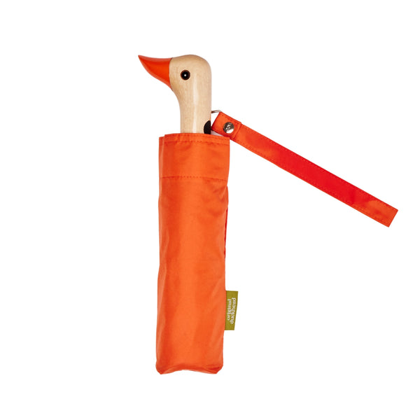 Orange duck-shaped umbrella with a matching cover on a white background