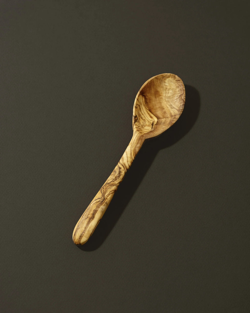Wooden spoon on a dark background