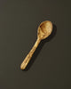 Wooden spoon on a dark background
