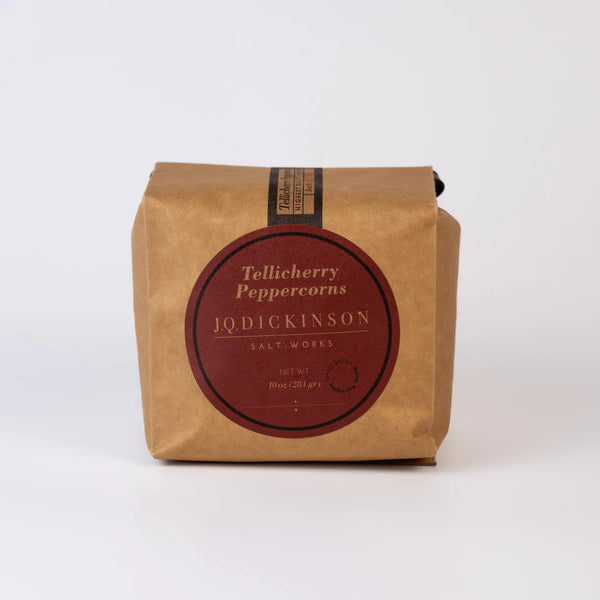 Kraft paper packaging with a red label featuring 'J.Q. Dickinson' on a white background