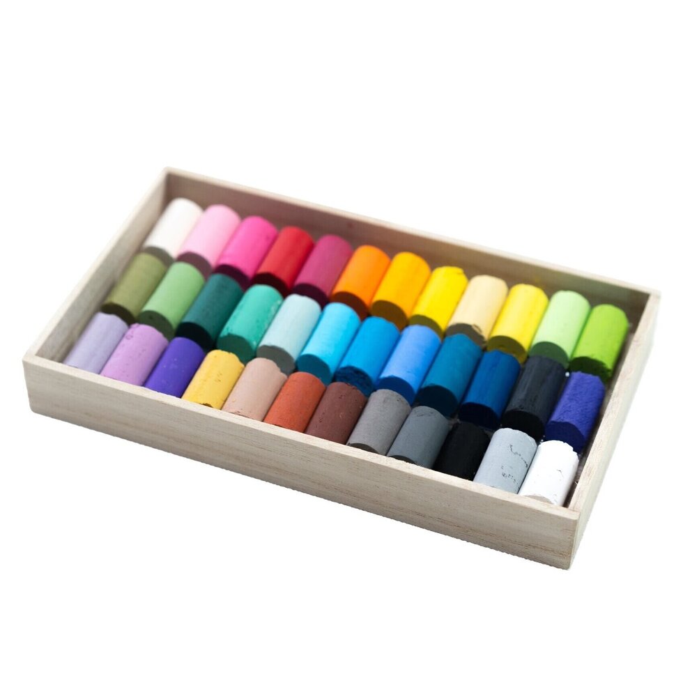 Set of colorful pastels in a wooden box on a white background