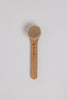 Wooden brush with bristle head on a light gray background