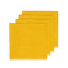 Set of four mustard yellow napkins on a white background
