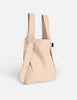 Beige backpack on a light gray background