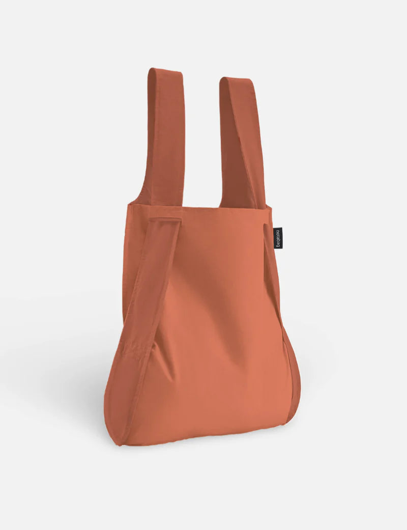 Orange backpack on a white background