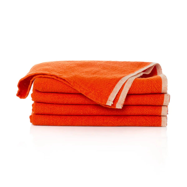 Stack of orange towels on a white background