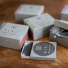 Hibi incense sticks in open packaging on a wooden surface