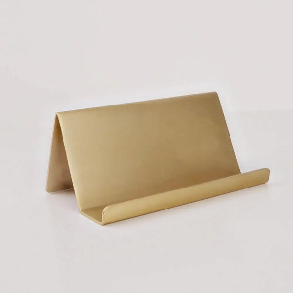 Brass card holder on a white background