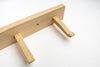 Wooden tool with two handles on a white background