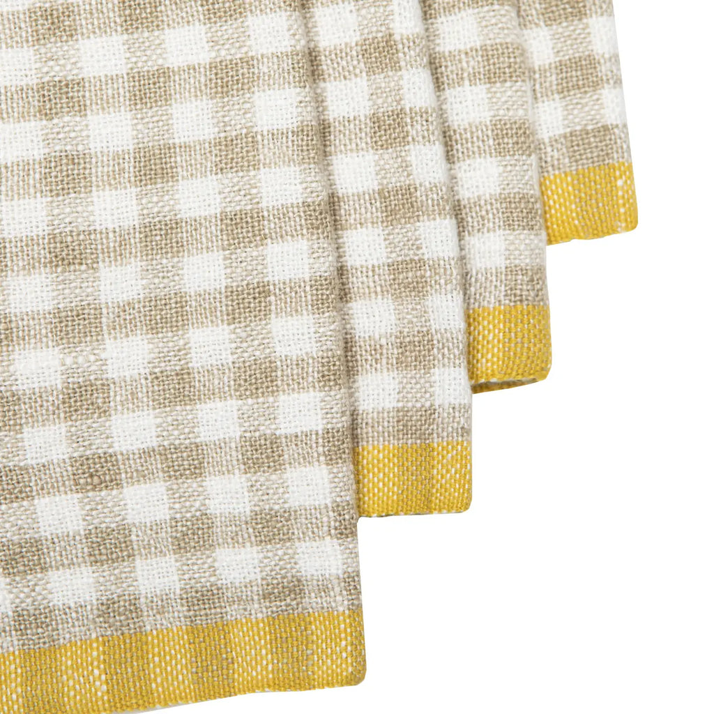 Checkered napkin with yellow trim on a white background