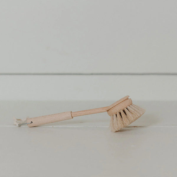 Wooden brush with bristle head on a white background