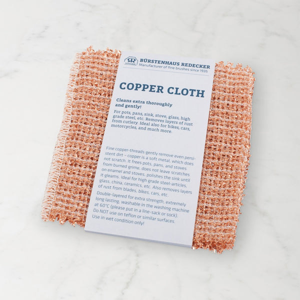 Copper cloth with a label on a light gray background