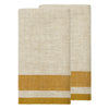 Two folded woven towels in a cream and mustard yellow herringbone pattern, stacked on a plain white background.