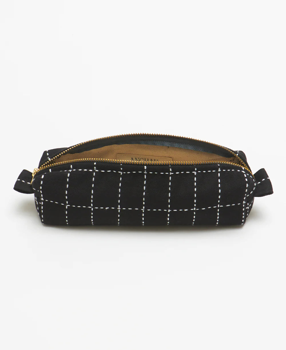 Black grid-patterned pouch with a gold zipper on a white background